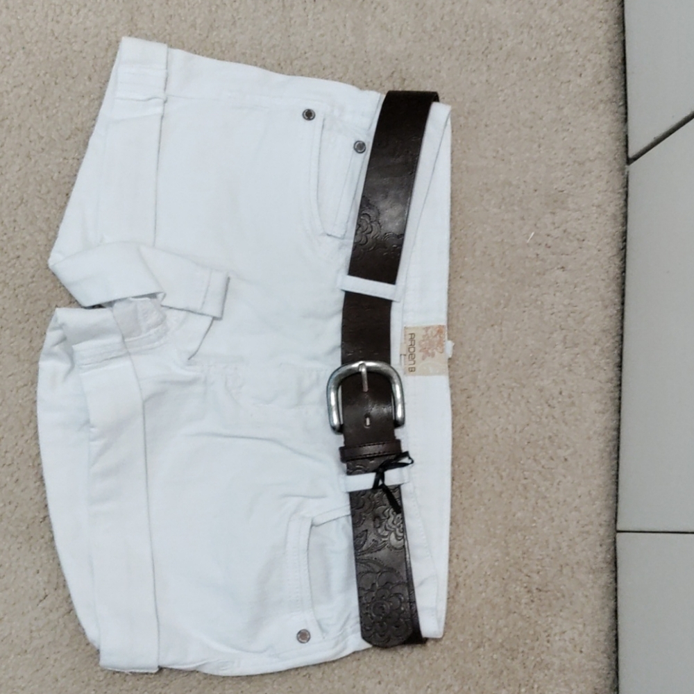White shorts with dark brown belt